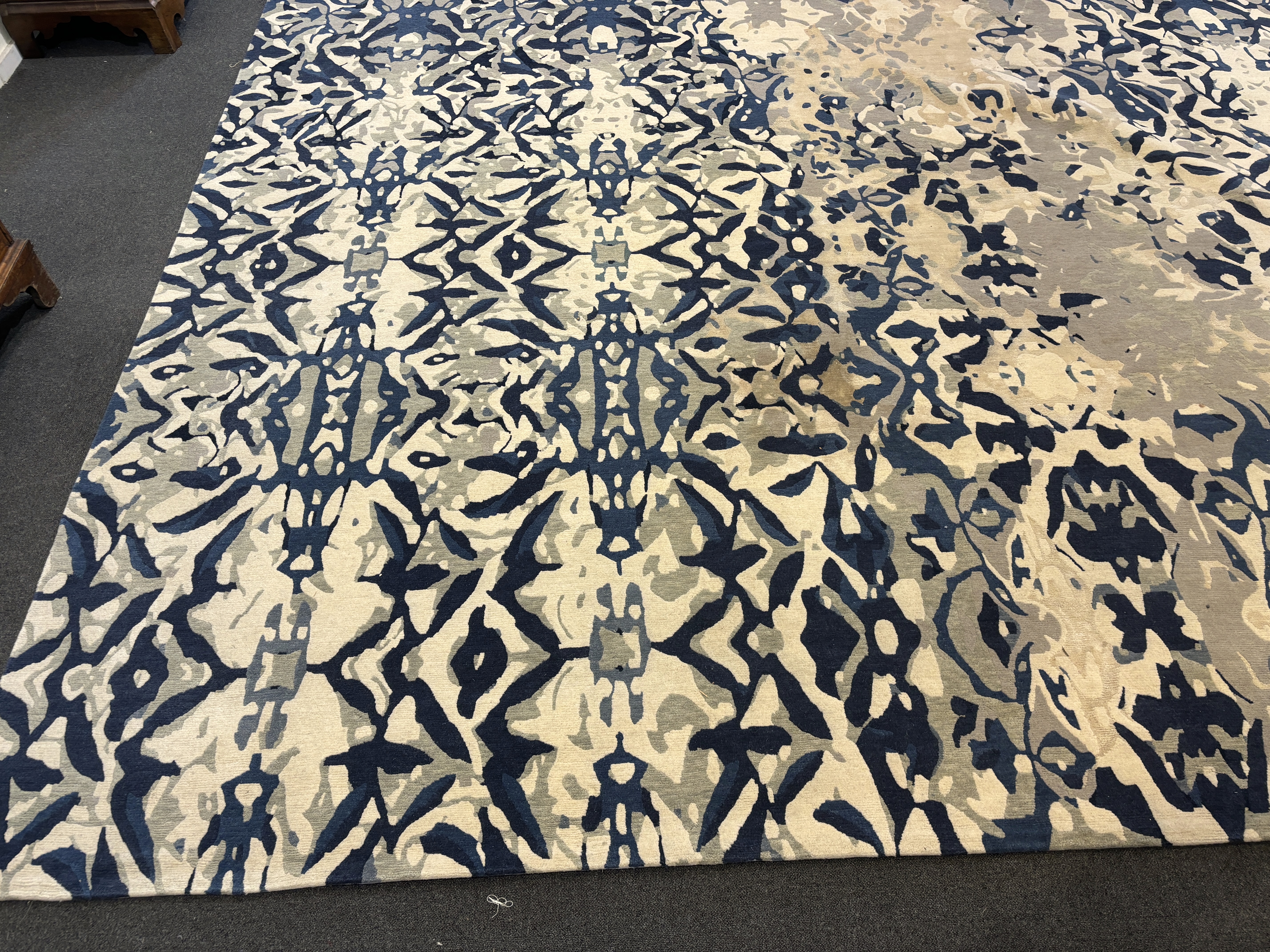 An Elizabeth Ashard 'Moghul', a silk and wool blue tones pattern carpet, 665 x 440cm